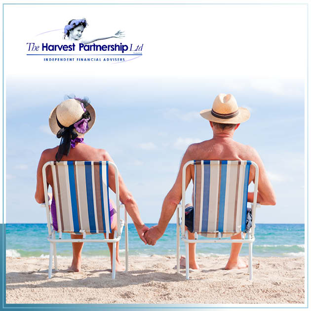 A picture of retirees in beach chairs looking out to sea with their backs to the camera.