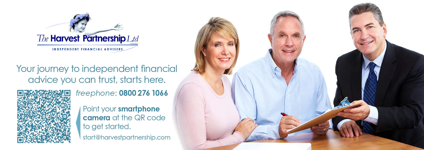 A photograph depicting a typical client meeting. A financial adviser is sitting at a desk with a husband and wife as they complete paperwork to create an investment portfolio.