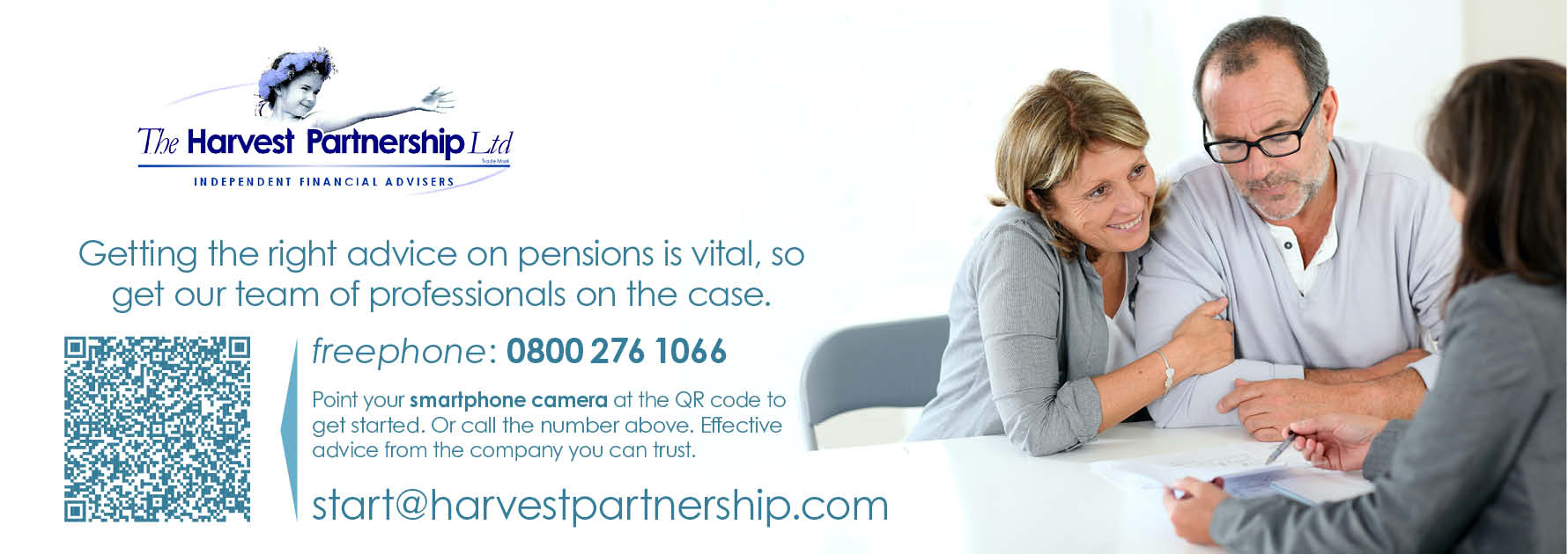 A photograph depicting a typical client meeting. A financial adviser is sitting at a desk with a husband and wife as they complete paperwork to create an investment portfolio.