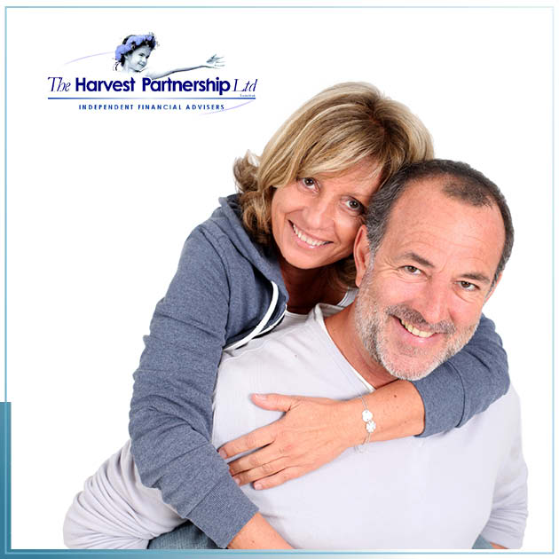 A picture of a couple of early retirement age with the lady clinging onto the fella's back, piggyback style. 